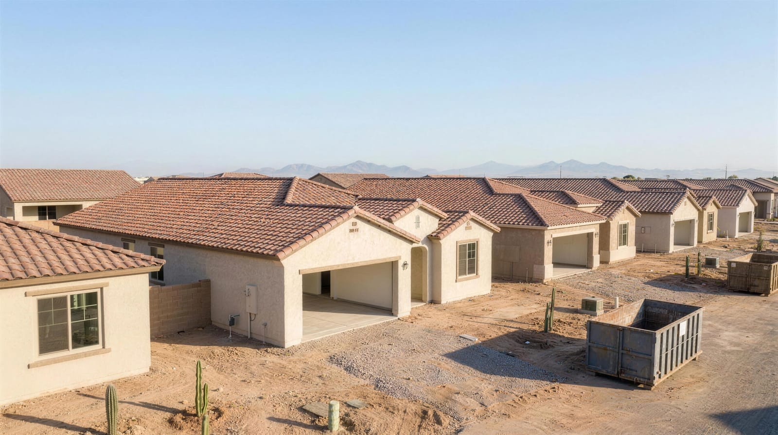 New-build community garages with bare concrete slabs, ready for a coating package